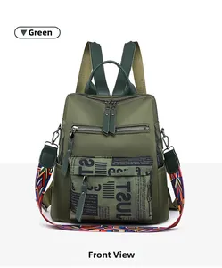 Close-up of green Oxford fabric backpack with decorative print and woven strap