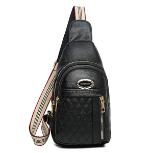 Women's black quilted leather chest bag with gold zipper and striped crossbody strap