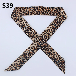 Detail view of leopard print skinny scarf with diagonal cut ends for bags