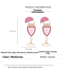 Detail view of pink champagne glass earrings with pearls and rhinestones size 5.4cm x 2.0cm