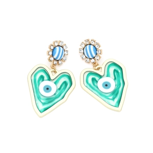 Gold heart drop earrings with green marble texture and evil eye design on white background