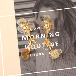Three-tiered gold hollow flower drop earrings with sparkling zircon centers for women