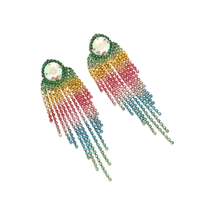 Macro shot of long rainbow gradient rhinestone tassel earrings with multi-color crystal drops