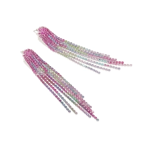 Macro detail of luxury gradient crystal tassel earrings with colorful rhinestone chains