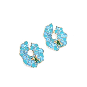 Detailed macro view of the enamel leaf earrings with a small green frog accent