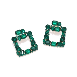 Detailed shot of emerald green square drop earrings with diverse crystal cuts in gold setting
