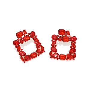 Detail view of luxury square red crystal drop earrings with gold alloy setting