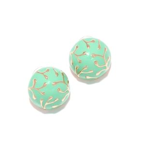 Mint green enamel round stud earrings with golden branch patterns on a white background