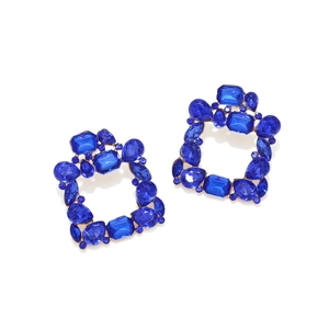 Detail showing geometric square earrings with sparkling blue rhinestones and gold alloy base