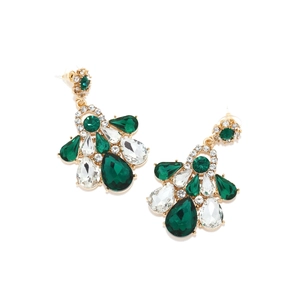 Close-up of vintage emerald glass earrings with pear-cut crystals and gold settings
