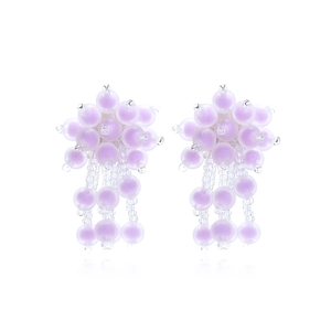 Detailed view of handmade lavender beaded floral earrings with lilac bead tassels