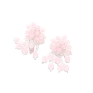 Detail view of pink matte beaded floral earrings with tiered fringe and cluster design