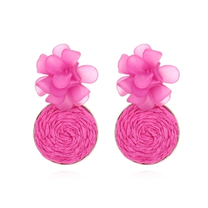 Handmade resin flower earrings with woven raffia circles in vibrant rose pink