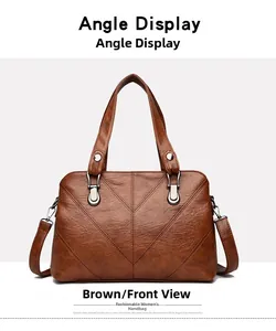 Detail of tan brown PU leather handbag featuring lychee texture and V-shaped stitching