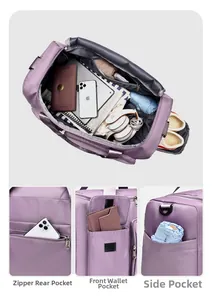 Detail of waterproof travel bag showing rear zipper pocket and spacious main compartment