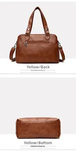 Detail view of the brown leather tote bag showing the back zipper pocket and flat bottom