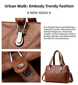 Detail of cross-stitch leather texture and silver hardware on dark brown tote bag