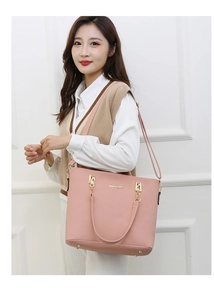 Pink faux leather tote bag with gold MeiGe hardware and detachable crossbody shoulder strap