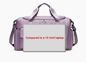 Detailed view of purple waterproof travel bag showing 14 inch laptop size comparison