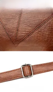 Detail of brown lychee grain leather with stitching and adjustable silver metal buckle