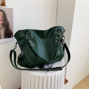 Minimalist large capacity dark green leather tote bag with stylish metal eyelets and strap