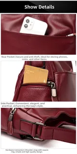 Detailed view of burgundy crossbody bag featuring rear zip pocket and silver metal hardware
