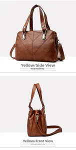 Detail view of large dark brown tote bag with V-shaped stitching and adjustable strap