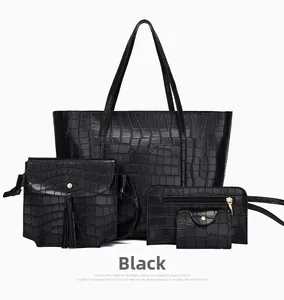 Dettaglio del set da 4 pezzi con borsa nera effetto coccodrillo e portafogli abbinati