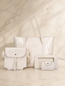 Macro detail of cream white faux crocodile leather texture and golden metal hardware