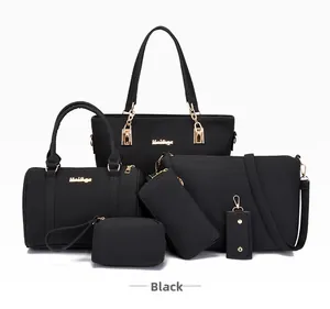 Detailed view of 6-piece black matte synthetic leather handbag set with gold hardware
