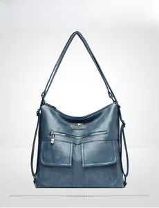 Bolso de hombro retro azul en cuero con bolsillos dobles y cierre metálico