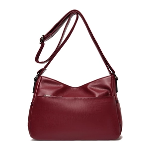 Burgundy quilted leather crossbody bag with front zipper and adjustable shoulder strap