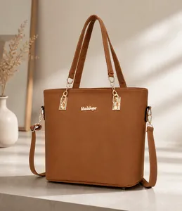 Brown PU leather tote bag with gold chain, adjustable shoulder strap, and front logo