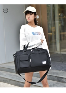 Detail of waterproof nylon travel bag featuring multi-pocket design and adjustable strap