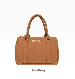 Detailed view of brown lychee grain leather handbag with gold metal logo and zippers