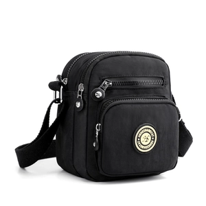 Black Oxford nylon crossbody bag with multiple zip pockets and adjustable strap
