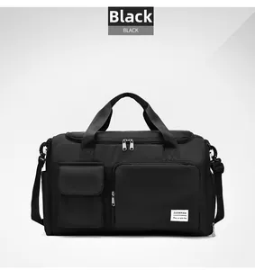 Close-up of black nylon travel bag featuring reinforced handles and side storage pockets