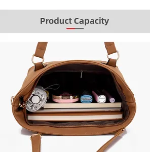 Top view of spacious interior of brown leather tote bag with pocket and accessories