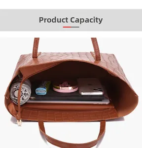 Spacious interior of a brown crocodile pattern tote bag showing storage capacity