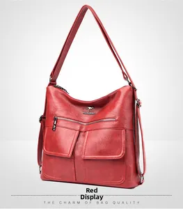 Detalle del bolso tote de cuero PU rojo con logo de marca, bolsillos con solapa y metal dorado
