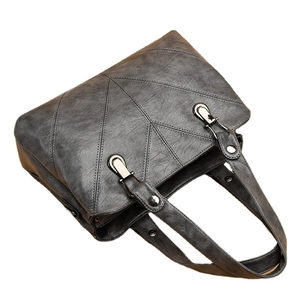 Retro dark grey tote bag with V-shaped stitching and polished silver metal hardware