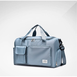 Detail view of water-resistant nylon travel bag with large capacity and zippered pockets