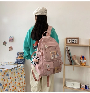 Sac à dos d'écolier en nylon rose pour étudiants avec badges décoratifs et peluche