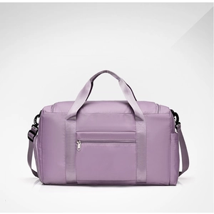 Detail of lavender waterproof travel bag with reinforced handles and adjustable shoulder strap