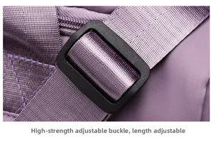 Macro detail of high-quality plastic adjustment buckle on purple nylon travel bag strap