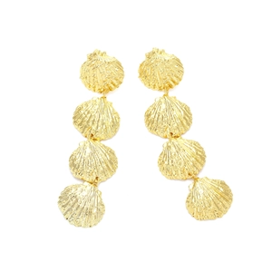 Detail of long gold tiered shell earrings featuring four textured metallic fan charms
