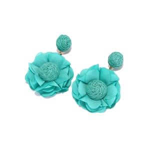 Detail of turquoise raffia woven stud and layered chiffon flower dangle earring