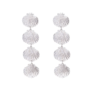 Silver multi-layered shell drop earrings with textured metallic finish on white background