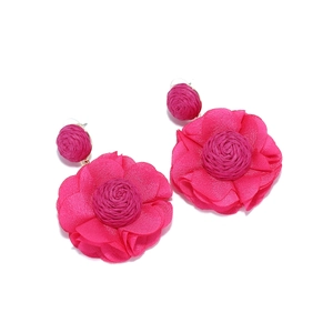 Detailed close-up of rose red raffia chiffon floral earrings with multi-layered petals
