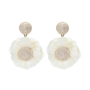 Detailed macro view of beige raffia woven core and layered white chiffon flower earrings